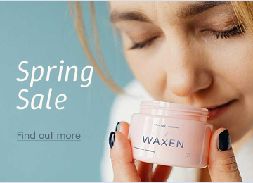 Banner of woman smelling candle.