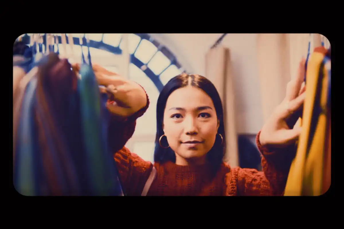 Video still of woman opening closet